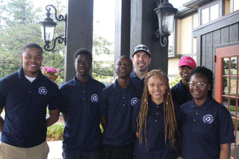 MAS Scholars Smiling in Group at Golf Outing
