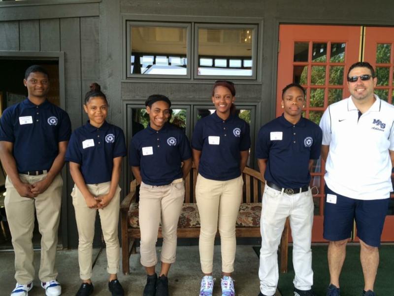 MAS High School Scholars Standing in Line at Gold Outing